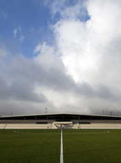 View of the football field in the background and the grandstand
