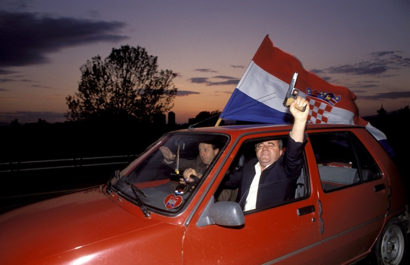 Civilians waving the Croat flag celebrate the vote in favour of independence for Croatia from the former Yugoslavia.